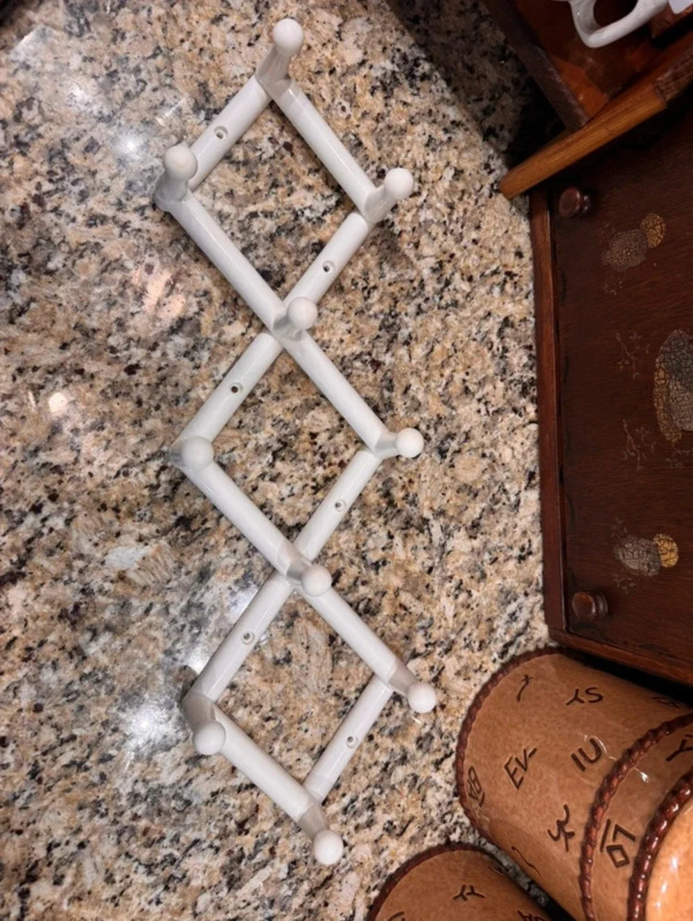 Vintage white plastic 10 peg accordion rack